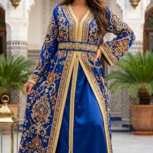 Model wearing a royal blue Moroccan takchita with ornate gold embroidery